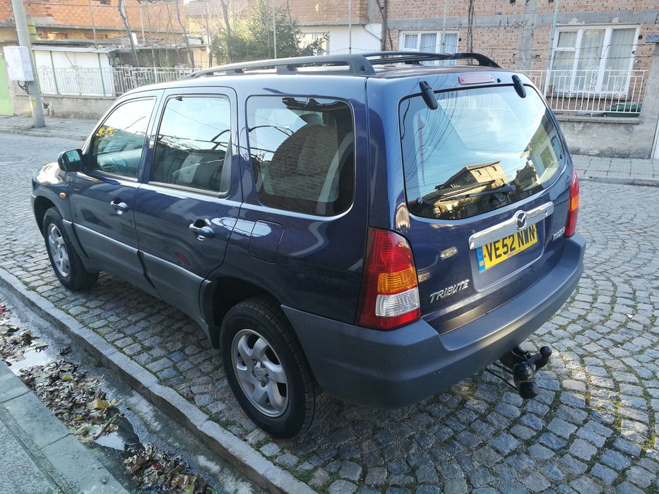 на части Mazda Tribute 2.0