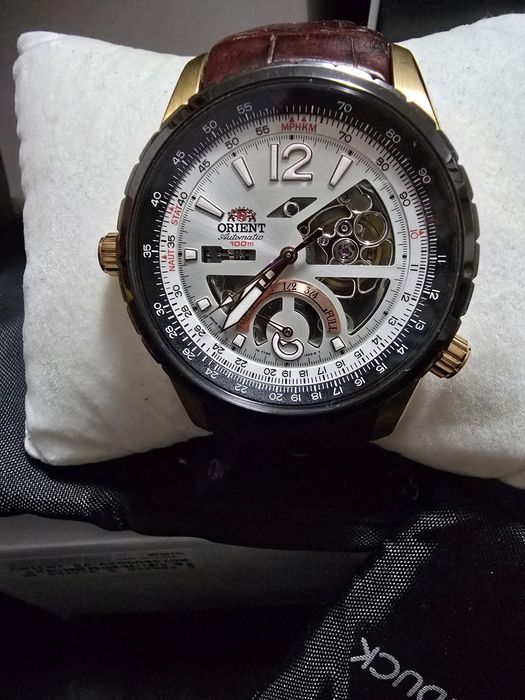 Vand ceas orient automatic pret 1000lei