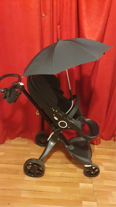 Carucior Stokke stare excelenta umbrela si geanta negru