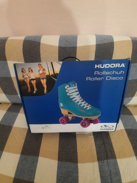 Роликовые коньки