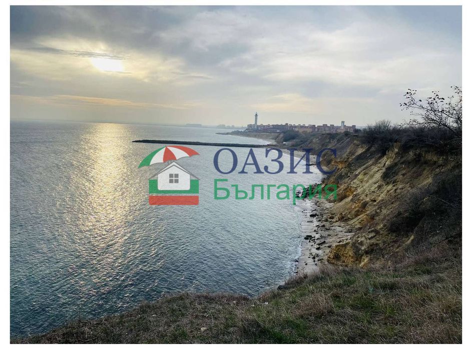 Парцел в статут на земеделски, на първа линия на морето, с. Ахелой,