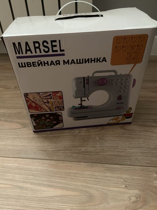 Электрическая швейна машинка.