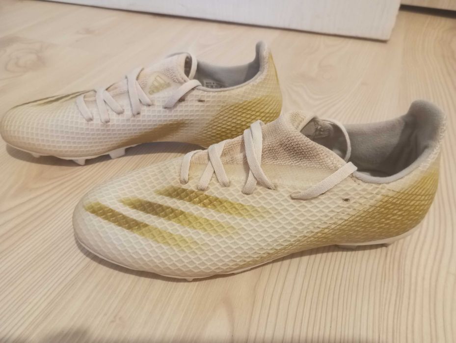 Футболни обувки adidas X GHOSTED.3 FG J в бяло и златно