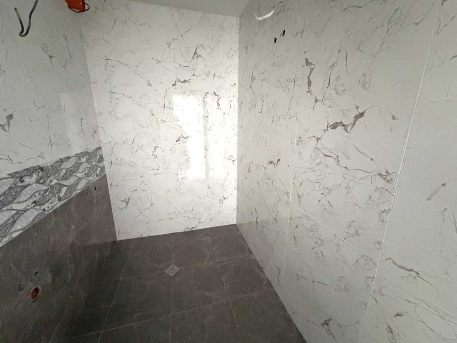 Необзаведен двустаен апартамент за продажба в затворен комплекс Pirin Castle Residence в Банско