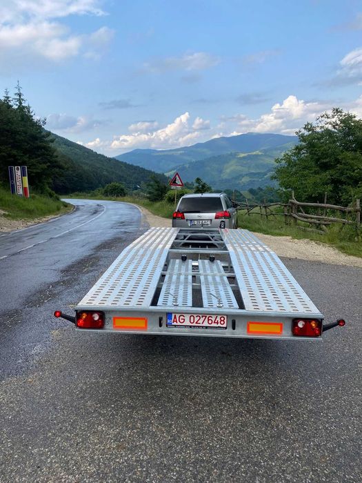 Transport auto pe platforma, tractare