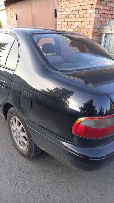 Тойота карина е механика.