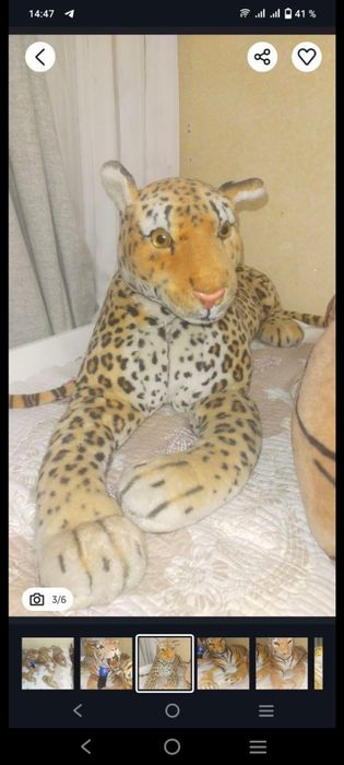 Игрушки тигры большие.