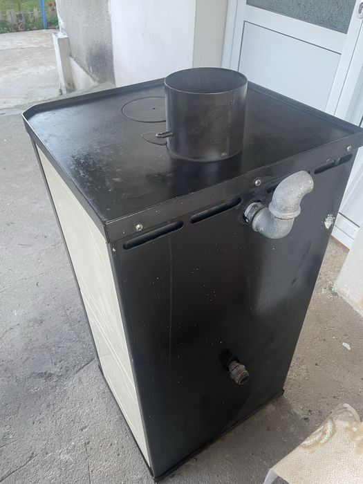 Продавам камина  на дърва с водна риза 13 кw