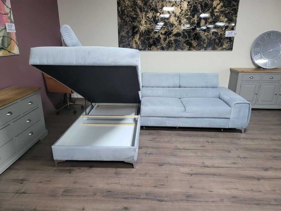 ПРОМОЦИЯ! Светло син ъглов диван от плат с функция сън и ракла