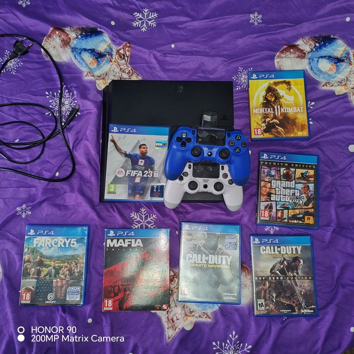 PS4 Slim + 2 manete + 7 jocuri – pachet complet, gata de joc