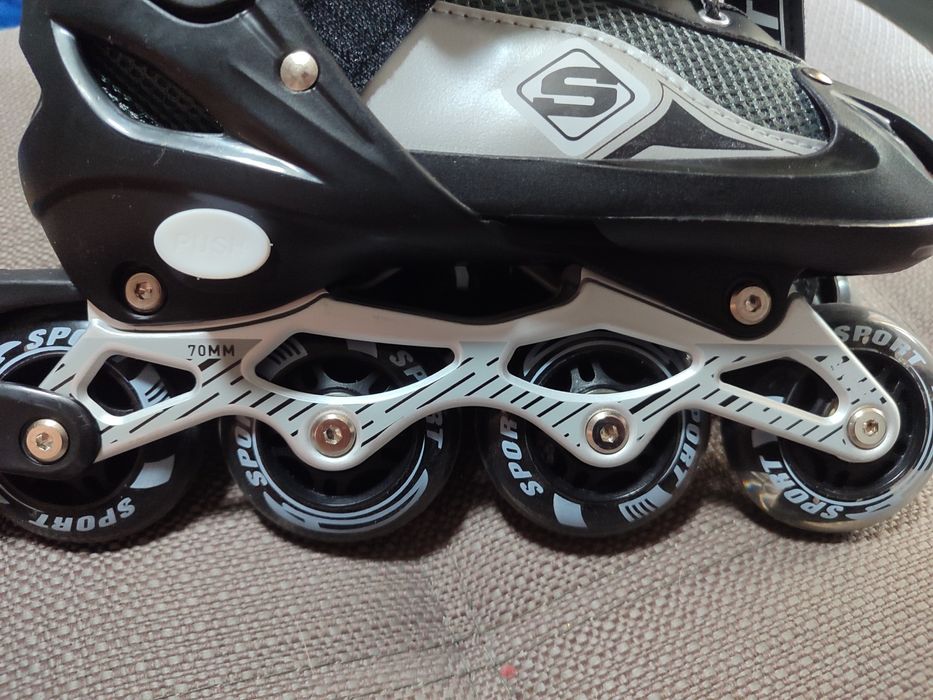 Роликовые коньки