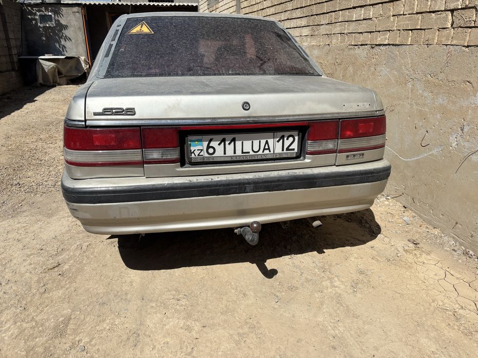 Мазда 626 Переходка запчасть разбор