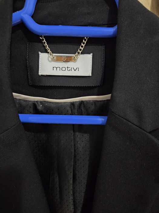 Sacou negru Motivi