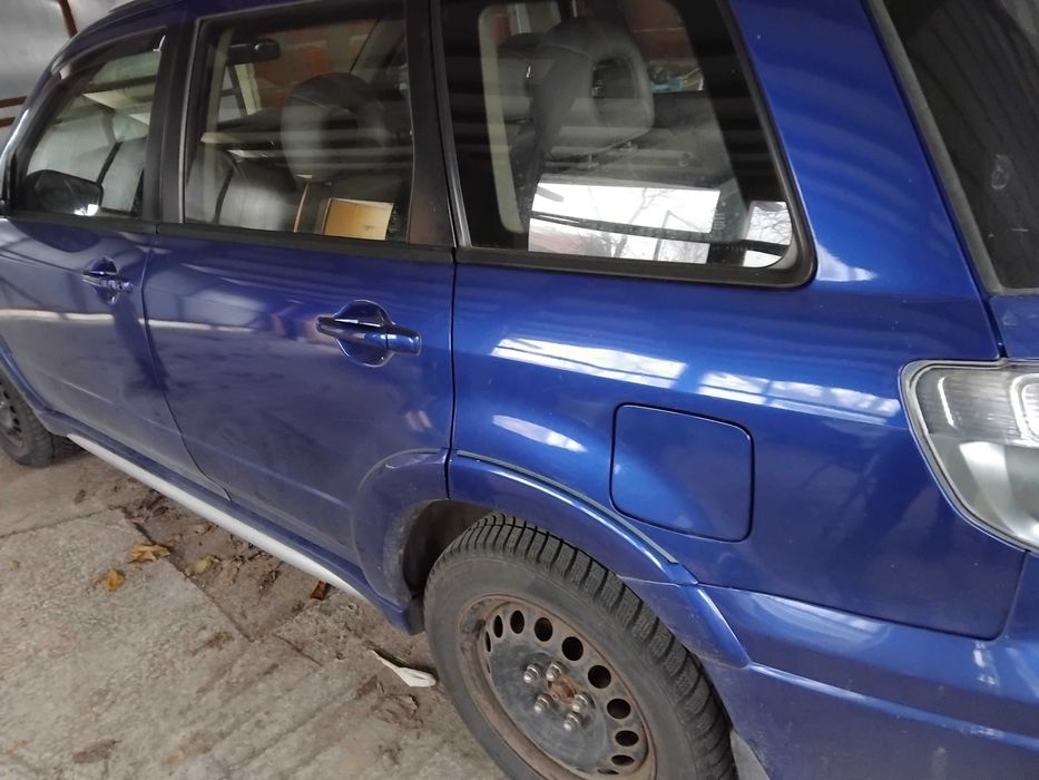 Мицубиши  олтлендър