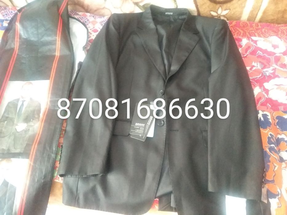 Продам черный костюм