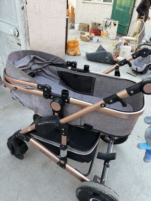 Детская коляска с автолюлкой