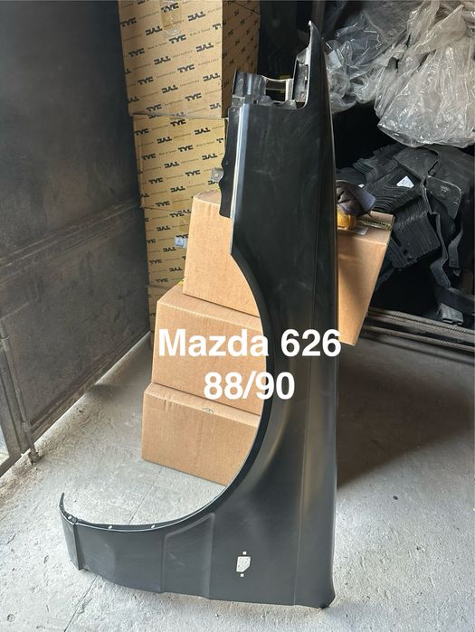 Крыло Mazda cronos.  Mazda 626 88/99