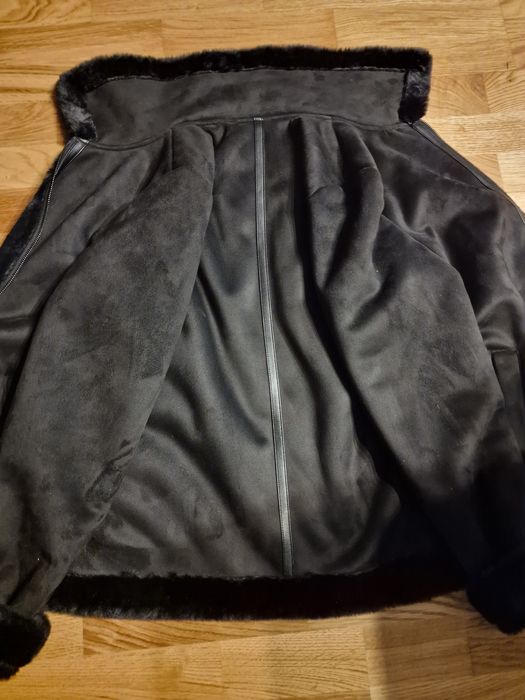 Haină din blană ecologică nouă.