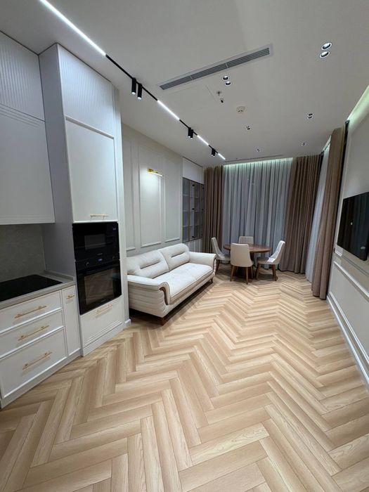 NestOne квартира 23 этаж 59м Блок А. Балкон в Ташсити парк смотрит