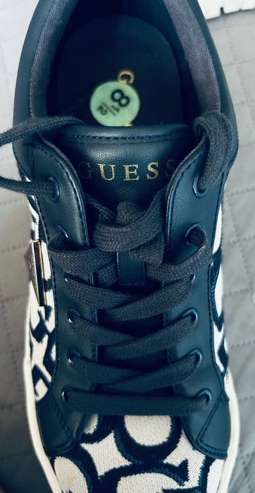 Guess Melya Logo Platform