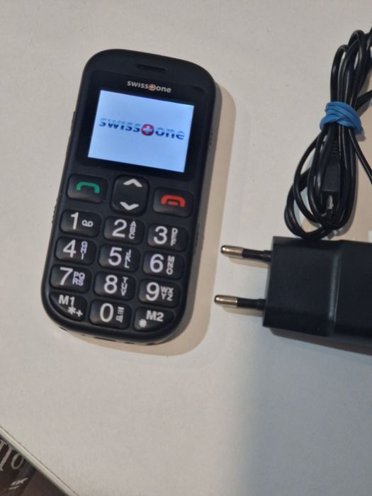 Telefon cu butoane cu încărcător