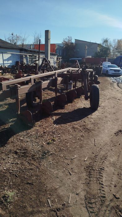 Плуг-9корпусный прицепной