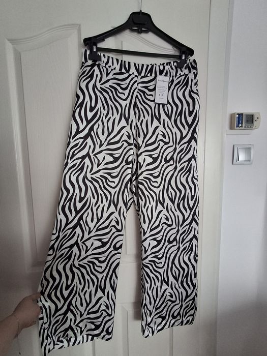 Pantaloni albi eleganți