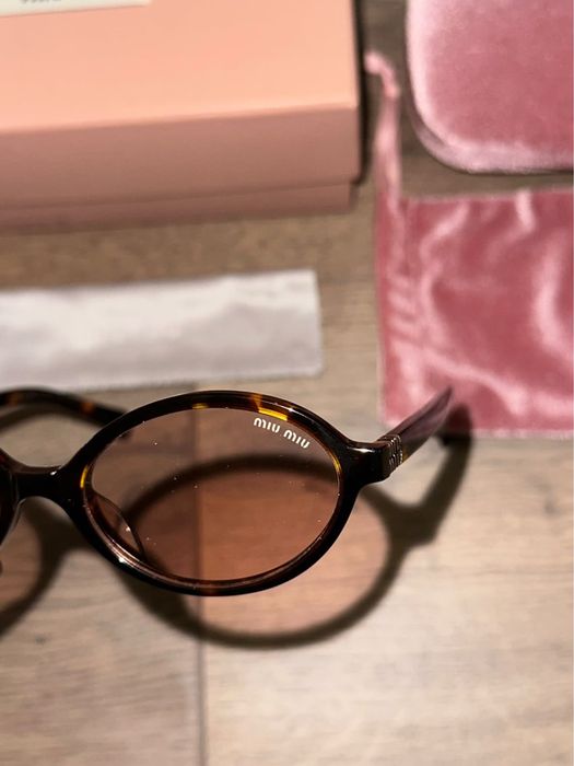 Нови Miu Miu Regard tortoiseshell-effect sunglasses