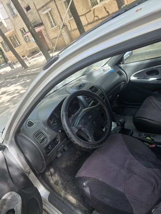 Митсубиси каризма 1.6 очень окономичный