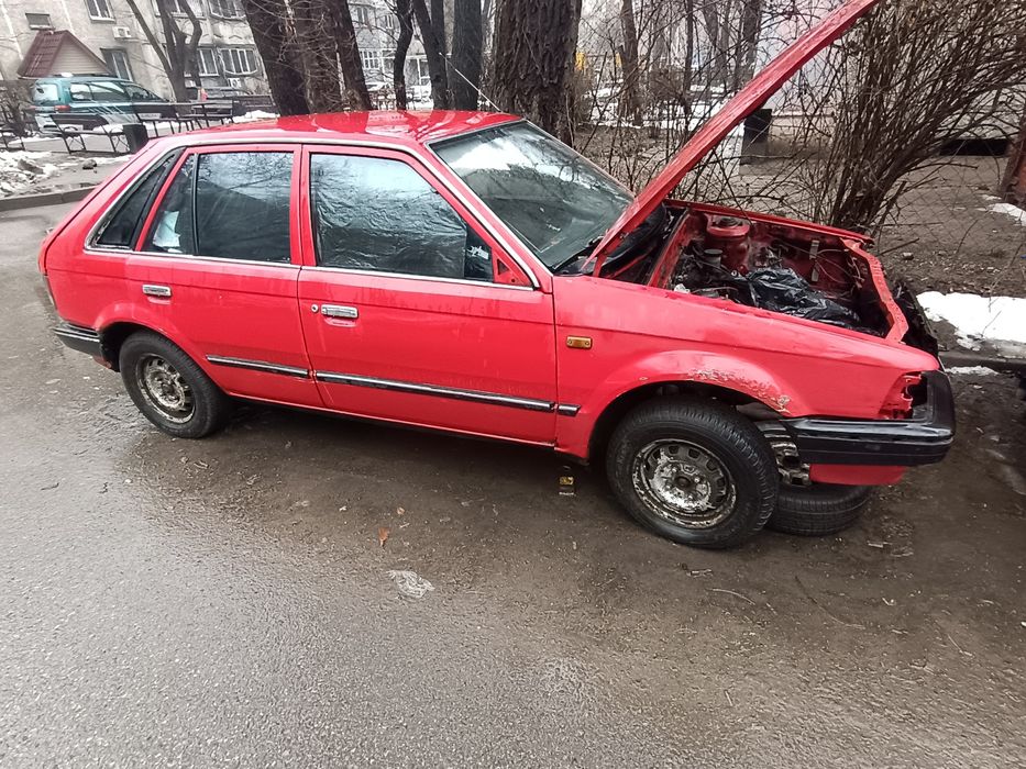 Передняя правая дверь Mazda 323 BF