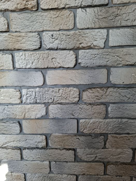 Балконы,кладка кирпича под расшивку.Утепление стен