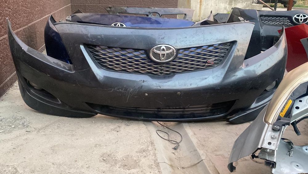 Передний бампер Королла 150