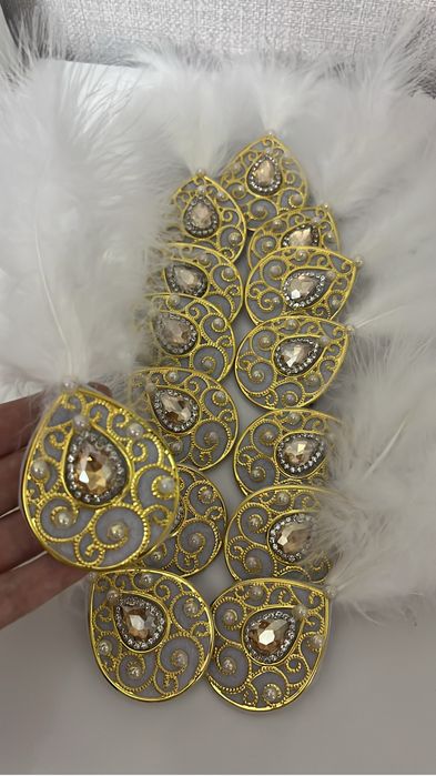 Үкілі брошь - Құдаларға төс белгі