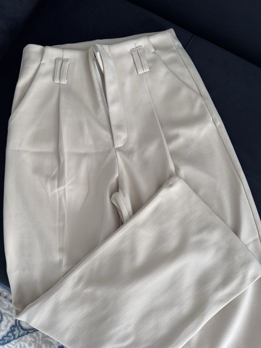 Теплые бежевые брюки