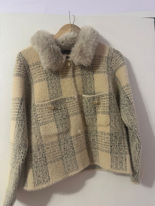 Дамска жилетка от естествен пух