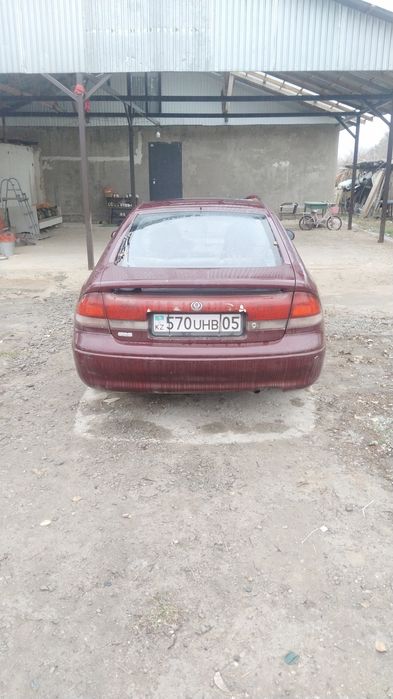 Машина Mazda кронс