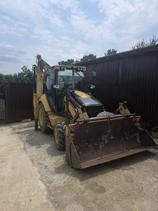 Vand Buldoexcavator Caterpillar