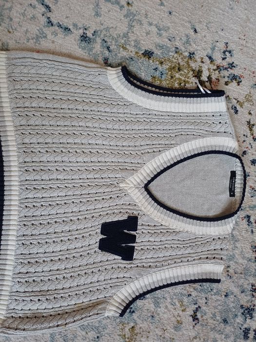 Продам  жилетку теплую новая