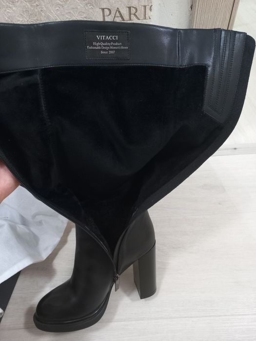 Продам новые кожаные сапоги