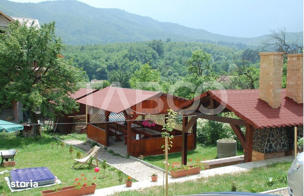 Pensiune 13 camere 16 bai sauna piscina si teren 1565 mp Cisnadioara