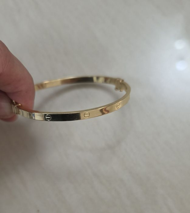 Bratara aur 14k dama Cartier