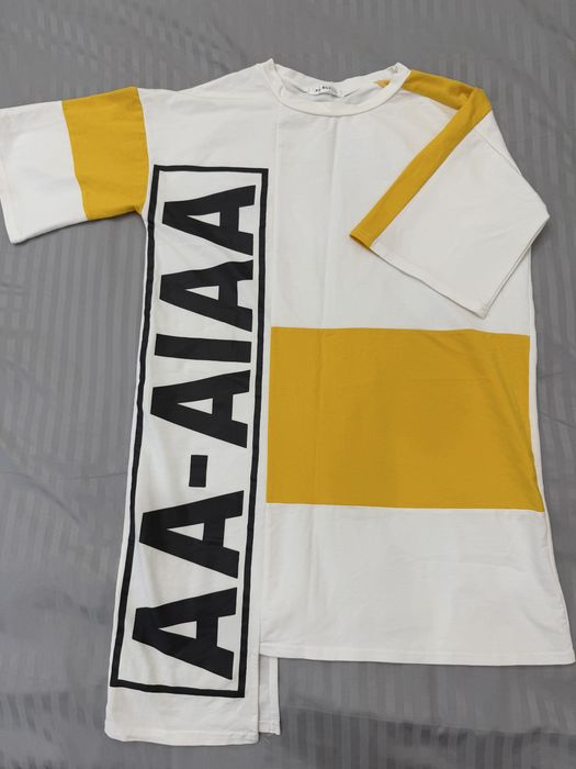 Стильная новая футболка в бело-жёлтом цвете.Красивая и яркая модель