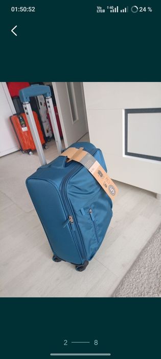 Vând troler material textil,dimensiune de 55 cm,nou, produs calitate.