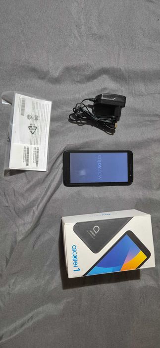 Телефон Alcatel one