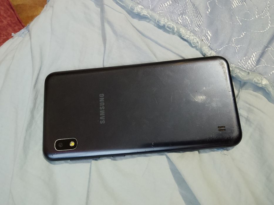 Samsung j 100 тел