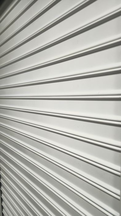 Станок для производства стальных рольставней.