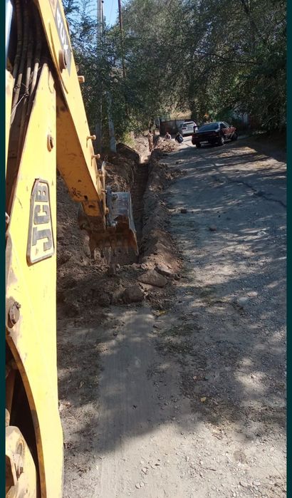 Экскаватор погрузчик трактор Талгар