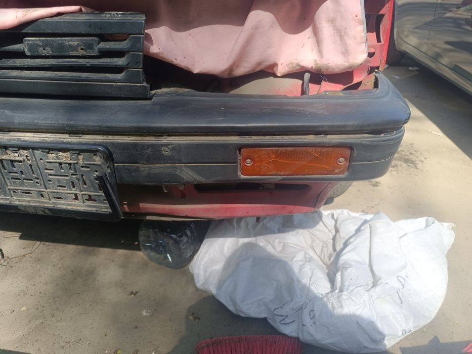 Передний бампер Mazda 323 BF