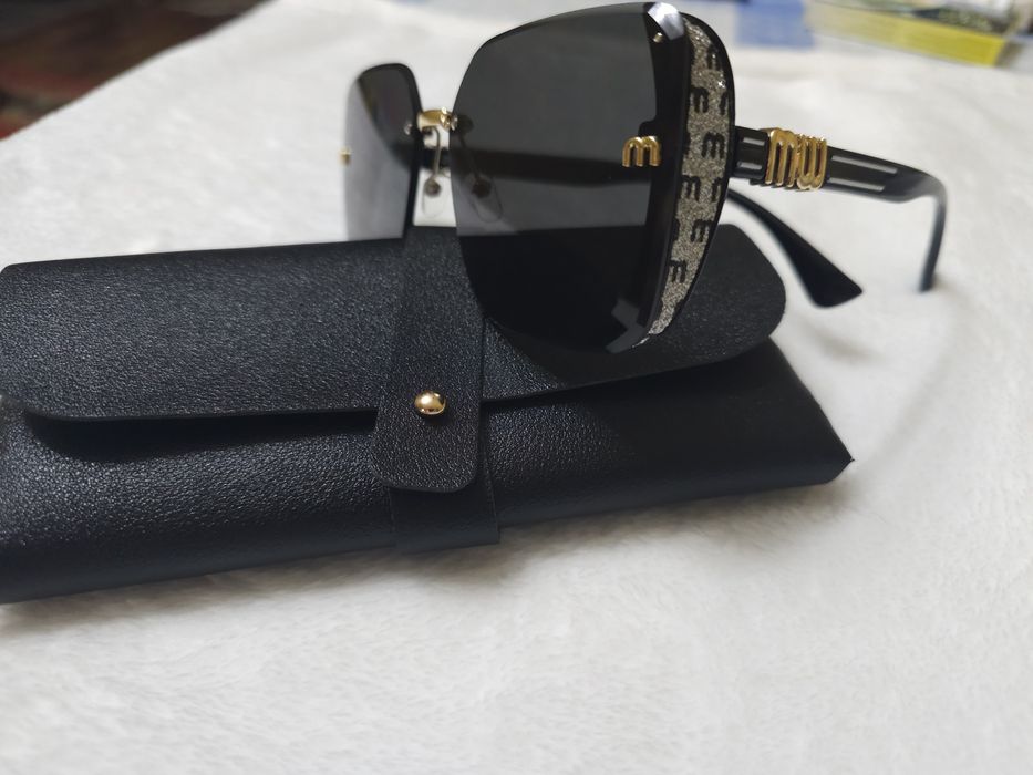 Солнцезащитные очки  Miu Miu (Миу Миу)