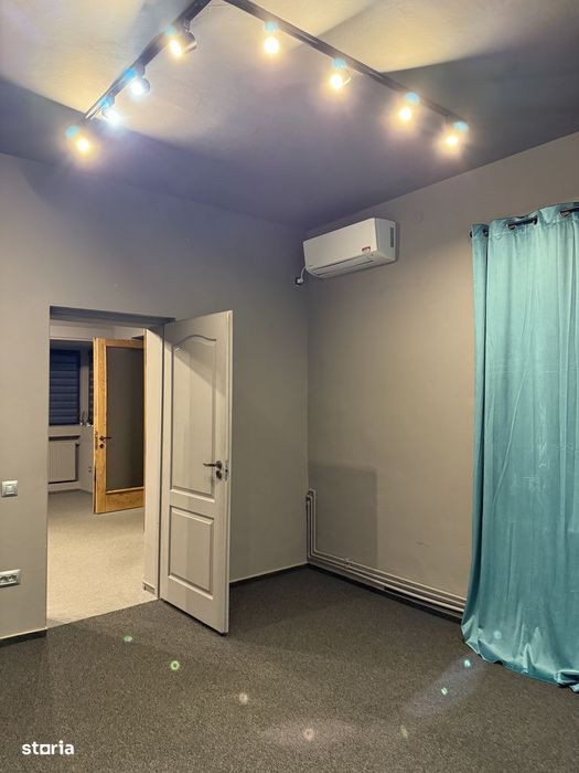 Apartament cu garaj, grădină, aer conditionat și centrală proprie